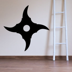 Black four-pointed ninja star with circular center hole