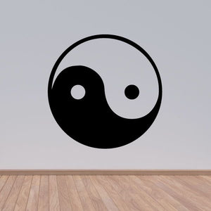 Yin and yang decal with black and white swirl inside a circular outline
