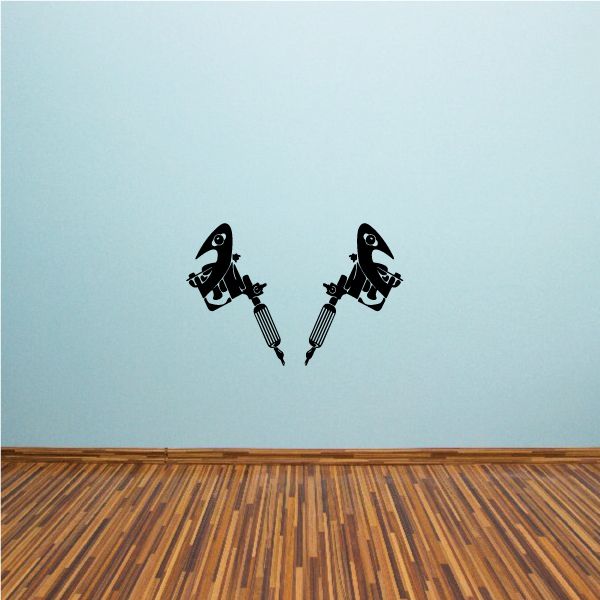 Tattoo gun vinyl decal showing two black tattoo guns with stylized text