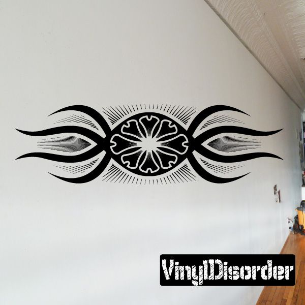 Black symmetrical tattoo wall decal with central sunburst and winged shapes