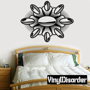 Black vinyl wall decal with tattoo-style burst flower design and oval center