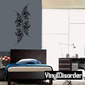 Vinyl tattoo wall decal with black swirl and flower motifs