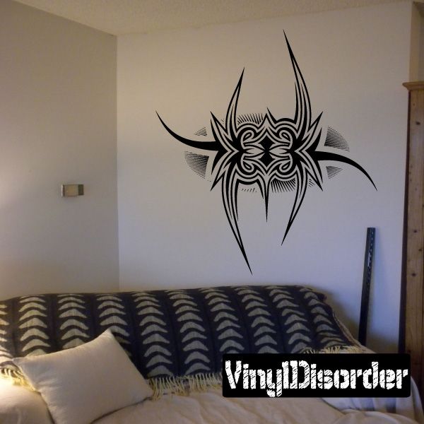 Vinyl tattoo wall decal with black tribal face and horned emblem design