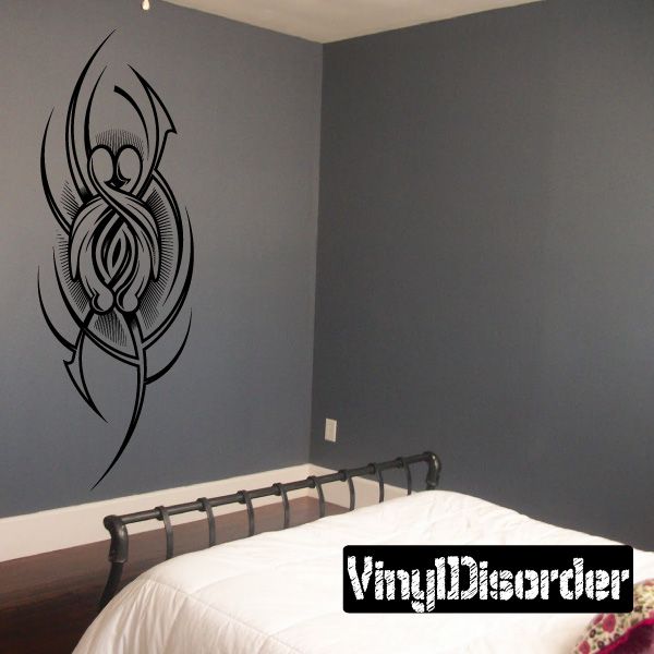 Black tribal tattoo-style wall decal with ornate crest and feathered wings.