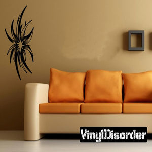 Black tribal tattoo vinyl wall decal with spiky wing-like starburst design