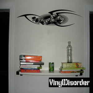 Black tribal tattoo-style vinyl wall decal with curved eye and claw design