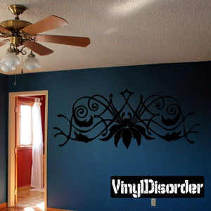 Black vinyl wall decal with ornate spider and swirling vine designs