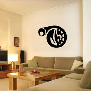Black vinyl tattoo wall decal with circular emblem and flame-like center