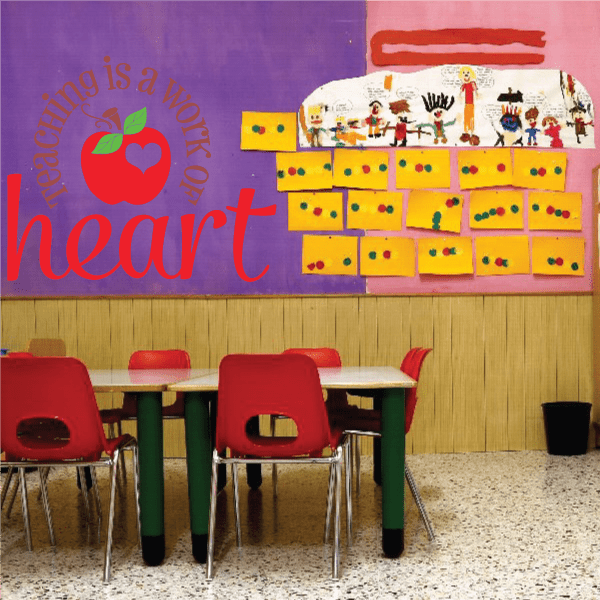 Classroom wall decal with red heart and text 'Teaching is a work of Heart'