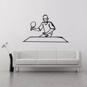 Tennis wall decal of a tennis player holding a racket, seated on court