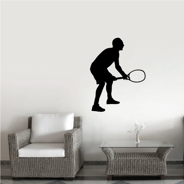 Tennis wall decal: black silhouette tennis player holding a racket
