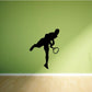 Tennis wall decal of a black tennis player silhouette holding a racket