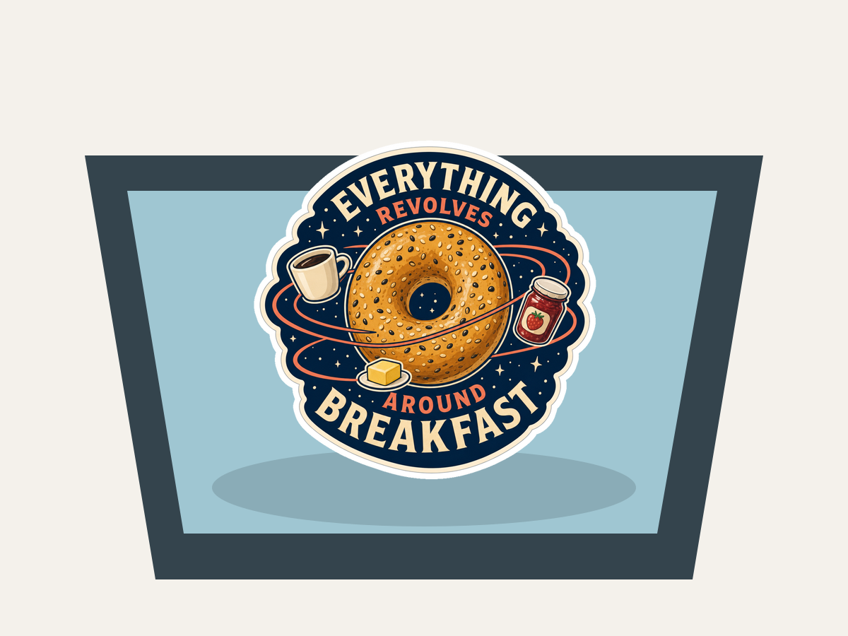 Round sticker featuring donut, coffee cup, and jam jars; reads “EVERYTHING REVOLVES” “AROUND BREAKFAST”.