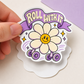 Close-up of “Roll With It” daisy vinyl sticker held in hand