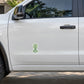 Garden skill tree sticker on white car door, small green tree logo
