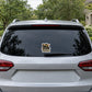 Cartoon goblin sticker on rear window, multicolor design