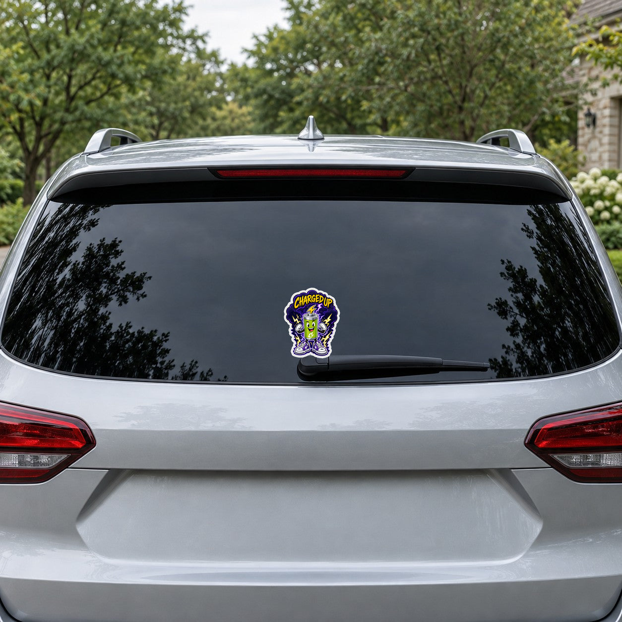 Die-cut "Charged Up" battery character sticker on a car trunk