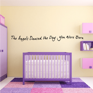 Wall decal with cursive text: The Angels Danced the Day You Were Born