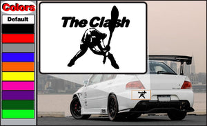 Rectangular white car decal with bold black "The Clash" text and guitar player graphic