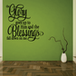 Wall decal with ornate script quote: “The Glory goes up to Him…”
