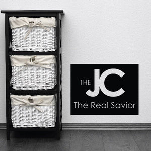 JC decal on black rectangle, white logo and text 'The Real Savior'.