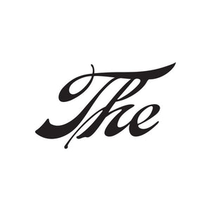 Vinyl sign decal with black cursive “The” lettering