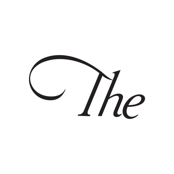Black vinyl text sticker reading “The” with a curved swoosh accent