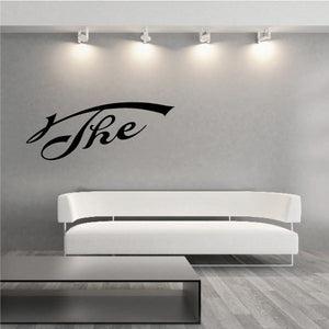 Vinyl wall decal with black cursive word 'The' above underline