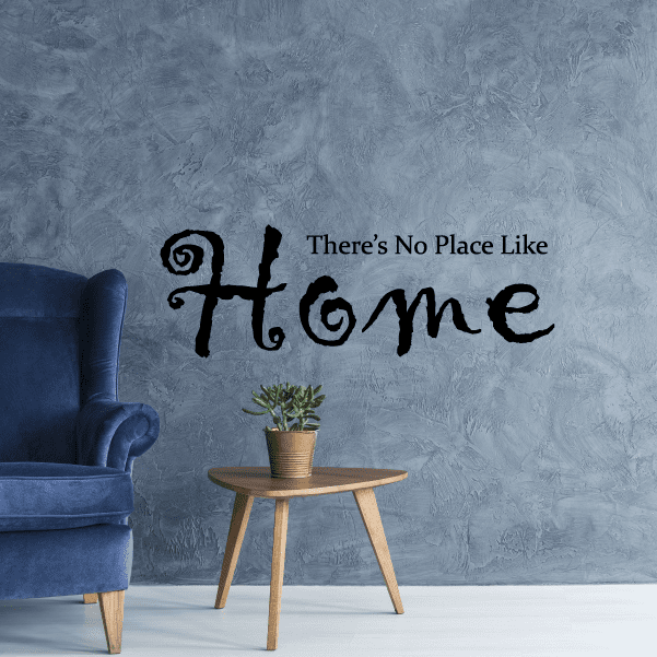 Black wall decal with cursive quote: There's No Place Like Home