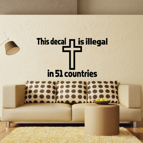 Wall decal with black cross and message text: 'This decal is illegal in 51 countries'