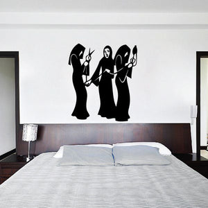 Black silhouette wall decal of three women in a trio, one central figure flanked by two