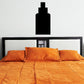 Three-tiered black wall decal, stacked rectangle design above bed