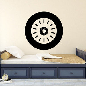 Black tire rim wall decal with white ring and center hub icon