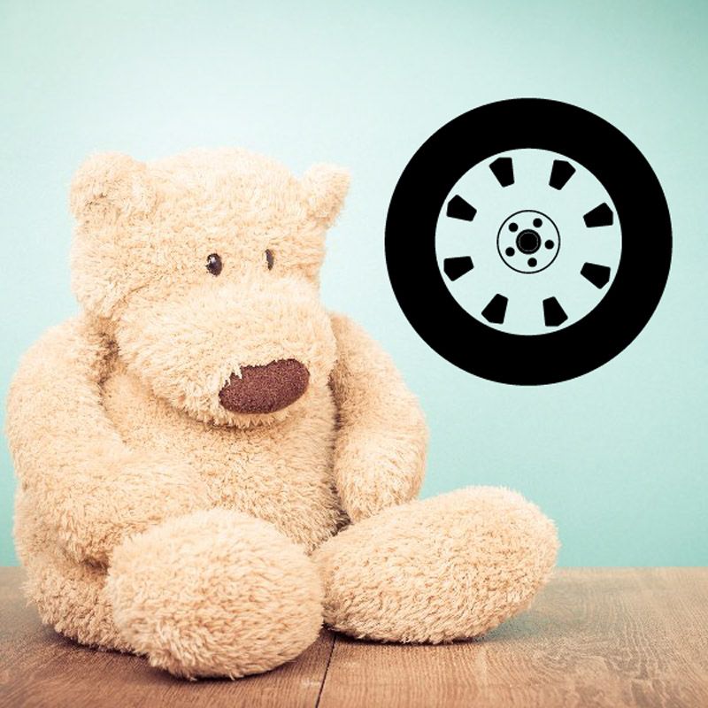 Wheel rim wall decal with black outer ring and white hub with spokes
