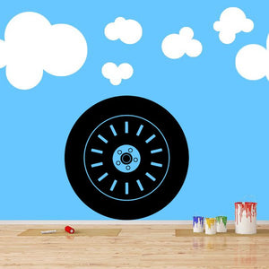 Black tire rim wall decal with blue center and cloud shapes