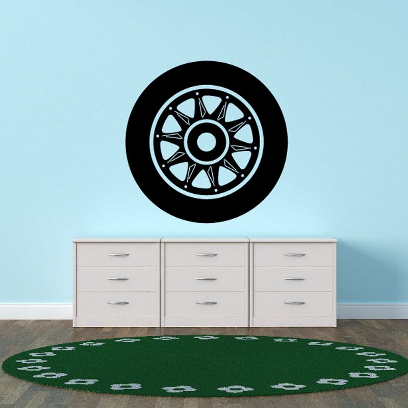 Black and white wheel rim wall decal with circular tire tread pattern