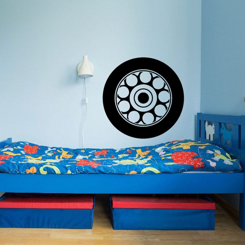 Tire rim wall decal: black circle with white tire tread and center hub graphic