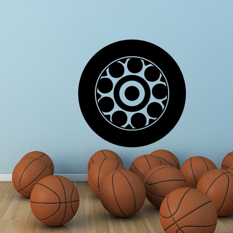 Tire rim wall decal, black circular design with silver wheel spokes.