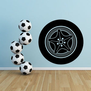 Vinyl wall decal: black tire rim design with white line details and soccer ball cluster