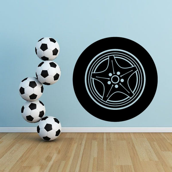 Vinyl wall decal: black tire rim design with white line details and soccer ball cluster