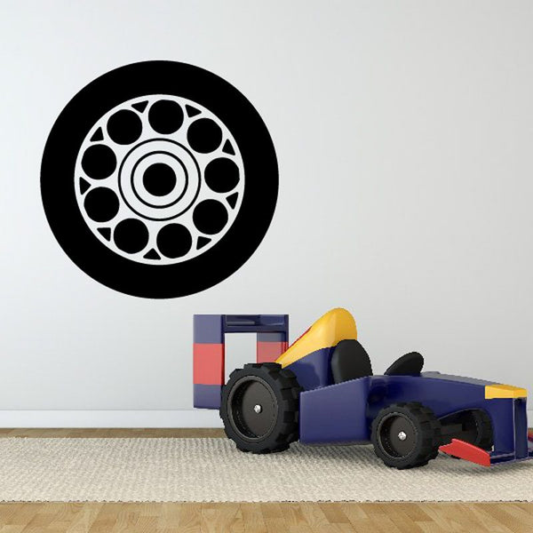 Wheel rim wall decal: black circle with white multi-spoke tire rim design