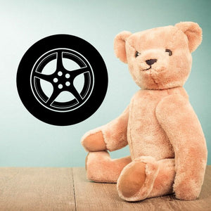 Black tire rim vinyl wall decal with wheel icon, circular design