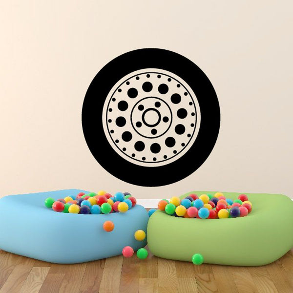 Circular tire rim vinyl wall decal with black and light gray wheel design