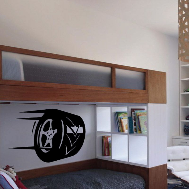 Black tire rim vinyl wall decal with circular wheel design and inner pattern