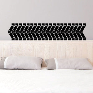 Tire tread wall decal with repeating black tread pattern