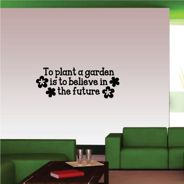 Garden quote wall decal with black lettering and flower icons: “To plant a garden”.