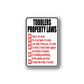 Rectangular Toddlers Property Laws wall decal with black and red quote text