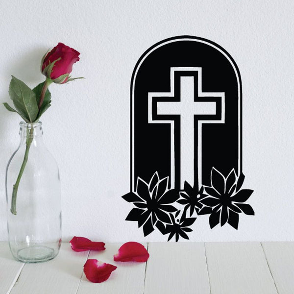 Black tombstone decal with white cross and flower accents