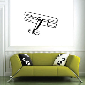 Black-and-white biplane wall decal with top-view outline and propeller