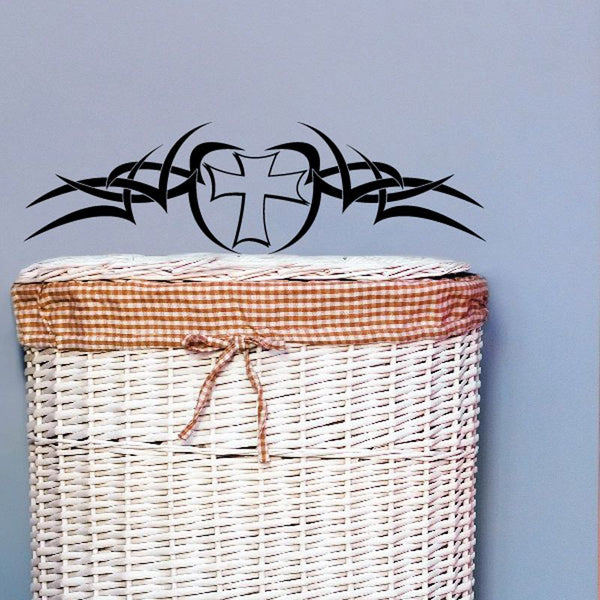 Black tribal cross decal with Jesus-style figure, ornate curved design